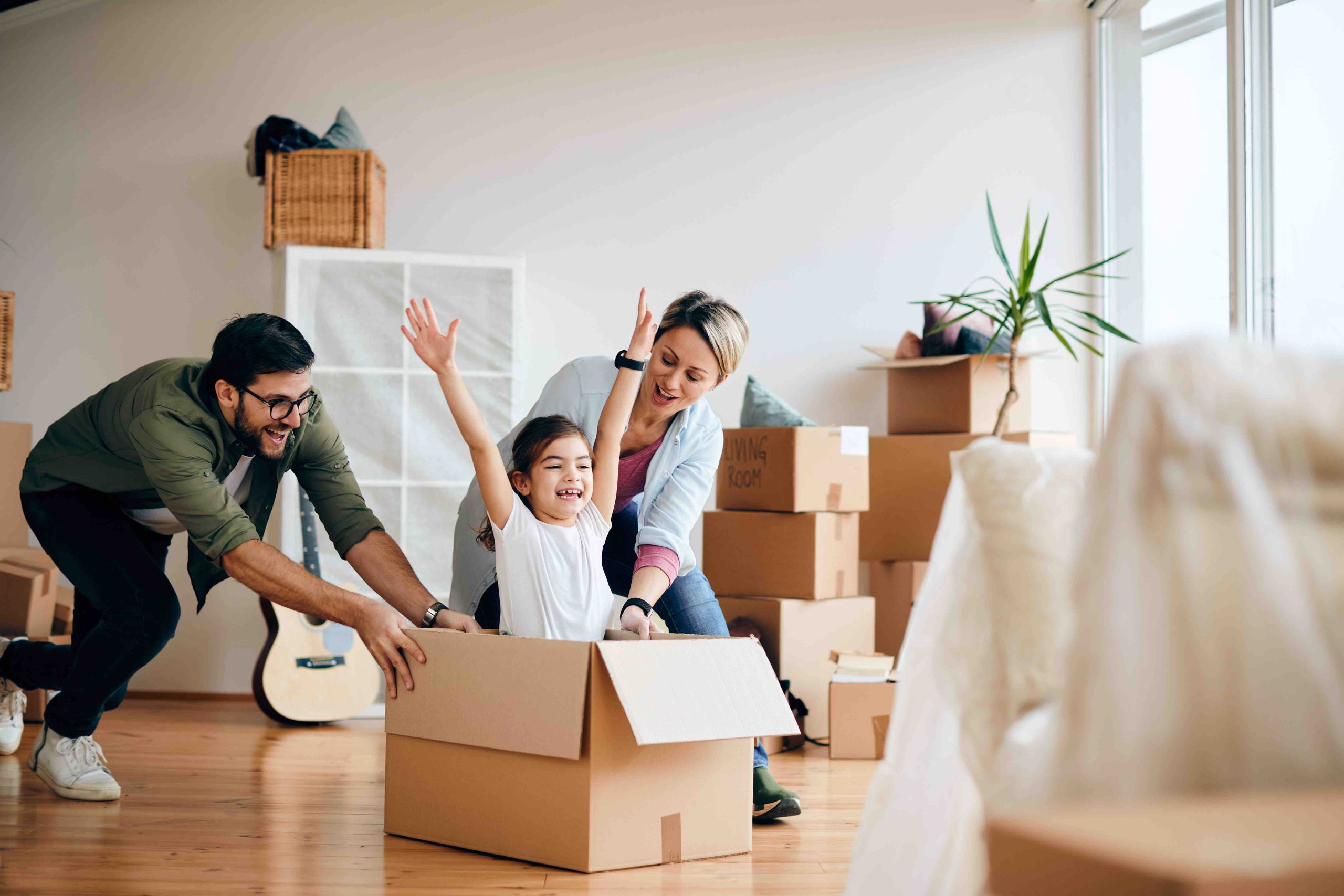 Carefree family having fun while moving into new home.